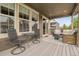 Partially covered patio featuring a table, chairs, and outdoor seating area at 19210 E Pacific Pl, Aurora, CO 80013
