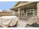 A partially covered deck features space for dining and grilling at 19210 E Pacific Pl, Aurora, CO 80013