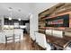 Dining area featuring modern light fixtures and a spacious wooden table with seating at 19210 E Pacific Pl, Aurora, CO 80013