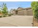 Inviting home exterior with three car garage, green lawn, and well-maintained landscaping at 19210 E Pacific Pl, Aurora, CO 80013