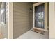 Close-up of a home's front door with a screen and welcome mat at 19210 E Pacific Pl, Aurora, CO 80013