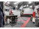 Well-lit garage features a durable checkered floor and organized storage solutions at 19210 E Pacific Pl, Aurora, CO 80013