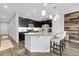 Spacious kitchen with granite island, dark cabinets, and stainless steel appliances at 19210 E Pacific Pl, Aurora, CO 80013
