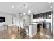 Bright open kitchen with a large island, stainless appliances, and modern finishes at 19210 E Pacific Pl, Aurora, CO 80013