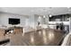Open-concept living room and kitchen area with modern lighting and updated decor at 19210 E Pacific Pl, Aurora, CO 80013
