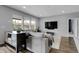 Bright living room features a comfortable sofa, large windows, and modern decor at 19210 E Pacific Pl, Aurora, CO 80013
