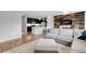 Inviting living space with a comfortable gray sofa, open to the modern kitchen and dining area at 19210 E Pacific Pl, Aurora, CO 80013