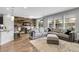Open living space featuring a comfortable sofa, dining area, and natural light from windows at 19210 E Pacific Pl, Aurora, CO 80013