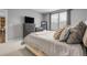 Bedroom features a soft color palette, natural light, and comfortable furnishings at 19210 E Pacific Pl, Aurora, CO 80013