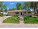 Charming brick ranch home with a well-manicured lawn and inviting curb appeal at 2816 S Wolff St, Denver, CO 80236