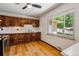 Well-lit kitchen featuring wood cabinets, white countertops, and a large window at 2816 S Wolff St, Denver, CO 80236