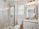 Modern bathroom with glass-enclosed shower, sleek vanity, and contemporary fixtures at 2362 Xanthia Way, Denver, CO 80238