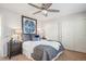 Comfortable main bedroom featuring a ceiling fan, soft bedding, and generous closet space at 2362 Xanthia Way, Denver, CO 80238