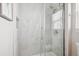 Contemporary shower featuring glass doors, sleek fixtures, and neutral tilework at 2362 Xanthia Way, Denver, CO 80238