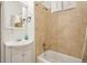 Classic bathroom with tiled shower-tub combo, vanity sink, and neutral color scheme at 915 26Th St, Denver, CO 80205