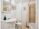 Bright bathroom with vanity sink, mirror, tiled shower, and neutral color scheme at 915 26Th St, Denver, CO 80205