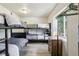 This bedroom features dark bunkbeds and light laminate flooring at 915 26Th St, Denver, CO 80205