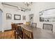 Elegant dining room with hardwood floors, chandelier, and a view of the kitchen at 915 26Th St, Denver, CO 80205