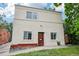 Exterior of a charming home with a well-maintained lawn and mature trees at 915 26Th St, Denver, CO 80205