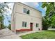 Exterior of a charming home with a well-maintained lawn and mature trees at 915 26Th St, Denver, CO 80205
