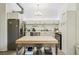 Modern kitchen with stainless steel appliances, center island, and ample cabinet space at 915 26Th St, Denver, CO 80205