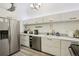 Bright kitchen featuring stainless steel appliances, sleek countertops, and ample storage space at 915 26Th St, Denver, CO 80205
