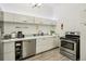 Well-lit kitchen featuring stainless steel appliances, sleek countertops, and ample storage space at 915 26Th St, Denver, CO 80205