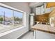 Compact kitchen features stainless steel appliances, wood countertop, and lots of natural light at 915 26Th St, Denver, CO 80205