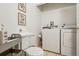 Functional laundry room featuring a washing machine, dryer, toilet and storage cart at 915 26Th St, Denver, CO 80205