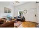 Cozy living room with hardwood floors, comfortable seating, and a decorative rug at 915 26Th St, Denver, CO 80205