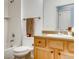 Bright bathroom featuring a shower-tub combination and wooden vanity at 13456 Via Varra # 315, Broomfield, CO 80020