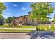Attractive exterior featuring well-maintained landscaping, a wrought-iron fence, and a modern building design at 13456 Via Varra # 315, Broomfield, CO 80020