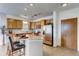 Well-lit kitchen boasts stainless steel appliances, a practical island, and plenty of cabinet storage at 13456 Via Varra # 315, Broomfield, CO 80020