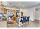 Open kitchen with stainless appliances, island seating, and ample storage for cooking and entertaining at 13456 Via Varra # 315, Broomfield, CO 80020