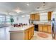 Bright kitchen with a large island, ample counter space, and an open concept design at 13456 Via Varra # 315, Broomfield, CO 80020