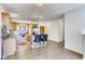 Modern kitchen featuring stainless steel appliances, a center island, and seamless flow to the living area at 13456 Via Varra # 315, Broomfield, CO 80020