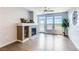 Living room showcasing abundant natural light, a modern fireplace, and access to a balcony at 13456 Via Varra # 315, Broomfield, CO 80020