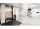 Well-lit parking garage with elevator access and ample parking spaces at 13456 Via Varra # 315, Broomfield, CO 80020