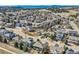 Scenic aerial view of a suburban neighborhood showcasing diverse homes and mature trees at 8385 Briar Trace Dr, Castle Pines, CO 80108