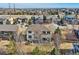 Aerial view of a house with large backyard, deck, and patio in a residential neighborhood at 8385 Briar Trace Dr, Castle Pines, CO 80108