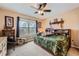 Bedroom with a large window and green themed bed at 8385 Briar Trace Dr, Castle Pines, CO 80108