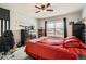 Bedroom with red themed bed and window at 8385 Briar Trace Dr, Castle Pines, CO 80108