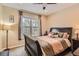 Bedroom with carpeted floors, natural light, and dark wood furniture at 8385 Briar Trace Dr, Castle Pines, CO 80108