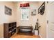 Inviting entryway featuring a storage bench, shoe rack and decor at 8385 Briar Trace Dr, Castle Pines, CO 80108