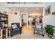 Open concept living space with hardwood floors, plush seating, and natural light at 8385 Briar Trace Dr, Castle Pines, CO 80108