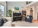 Bright living room featuring a black piano, plants, and plush seating on neutral colored carpet at 8385 Briar Trace Dr, Castle Pines, CO 80108
