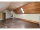 Ample attic bedroom with wood-paneled ceilings and skylight at 1340 N Gilpin St, Denver, CO 80218