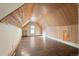 Large attic bedroom with hardwood floors and sloped ceilings at 1340 N Gilpin St, Denver, CO 80218