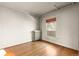 Simple bedroom with hardwood floors and a radiator at 1340 N Gilpin St, Denver, CO 80218