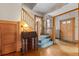 Entryway with hardwood floors, staircase, and vintage secretary at 1340 N Gilpin St, Denver, CO 80218